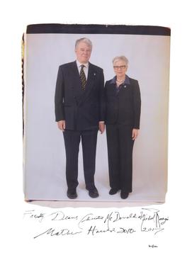 man standing on the left, woman standing on the right