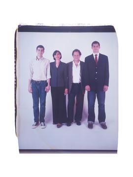 photo of 4 people standing in a line